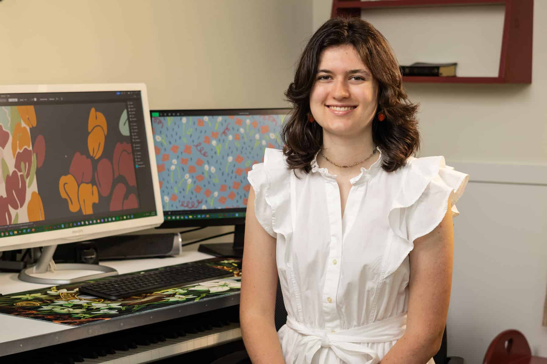 beth sitting near the computer.
