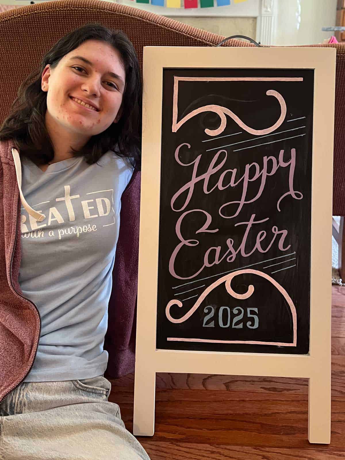 beth posing next to her happy easter sign.